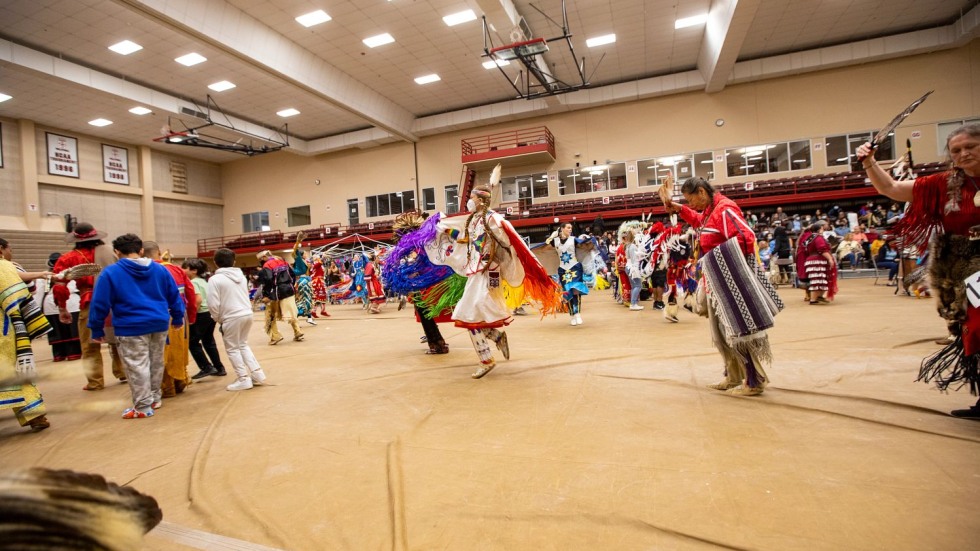 people dancing in Native American regalia