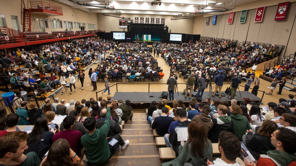 1,000 people sitting in a basketball stadium