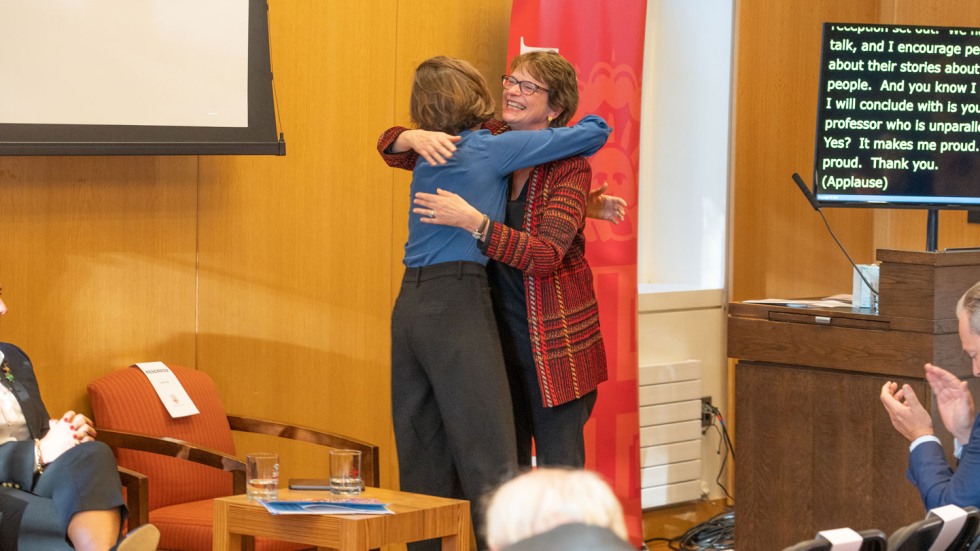 Laurel Bestock hugging Christina Paxson