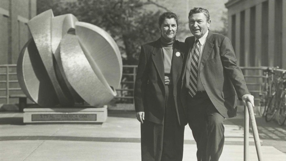 arte and martha joukowsky standing in front of a sculpture on the Brown University campus