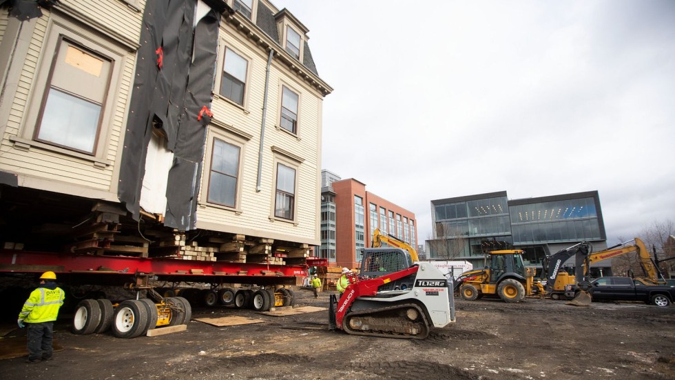 historic building on wheels in the middle of a construction site