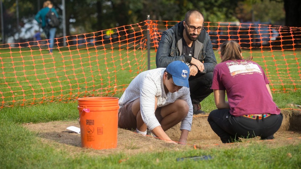 people digging at an archaeological site