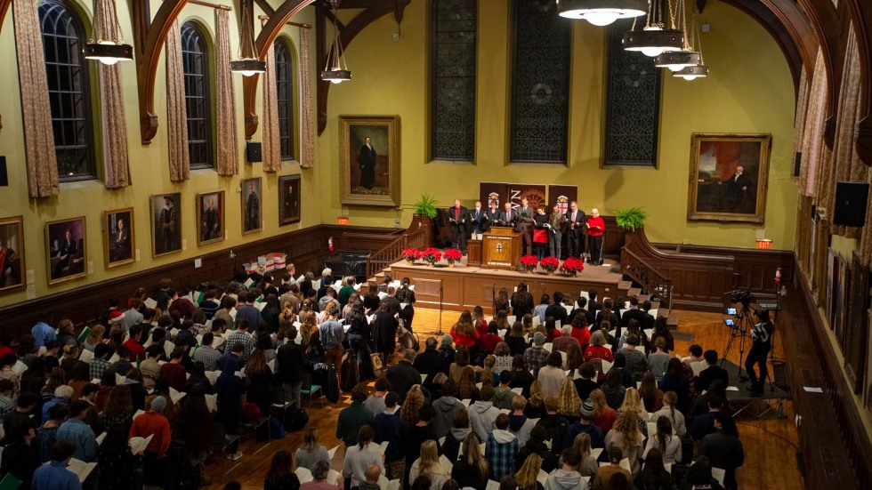 People sitting inside Sayles Hall 