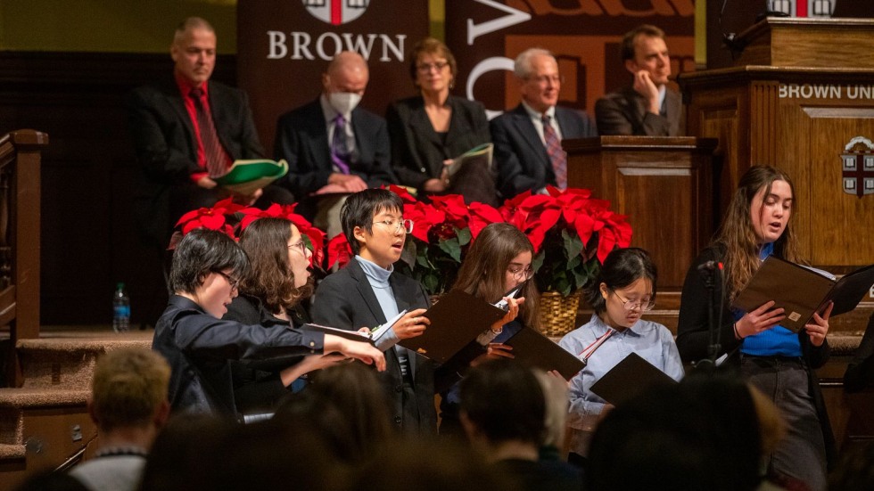 a cappella group singing in front of an audience