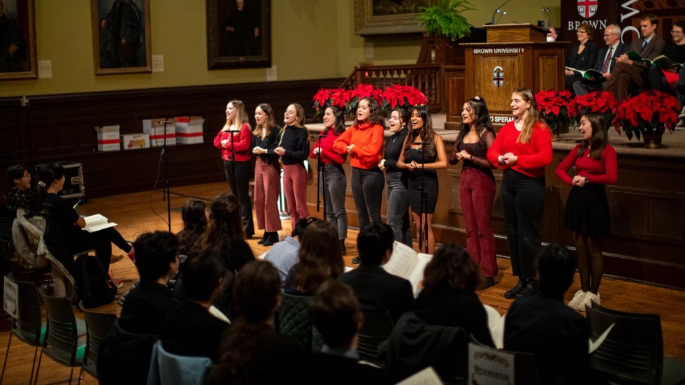 women's a cappella group singing in front of an audience