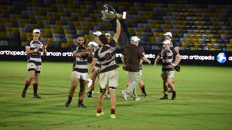 A player hoists the trophy