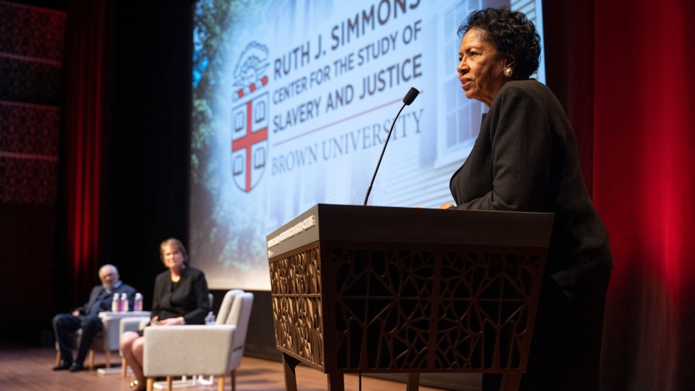 Ruth Simmons standing at a podium in an auditorium