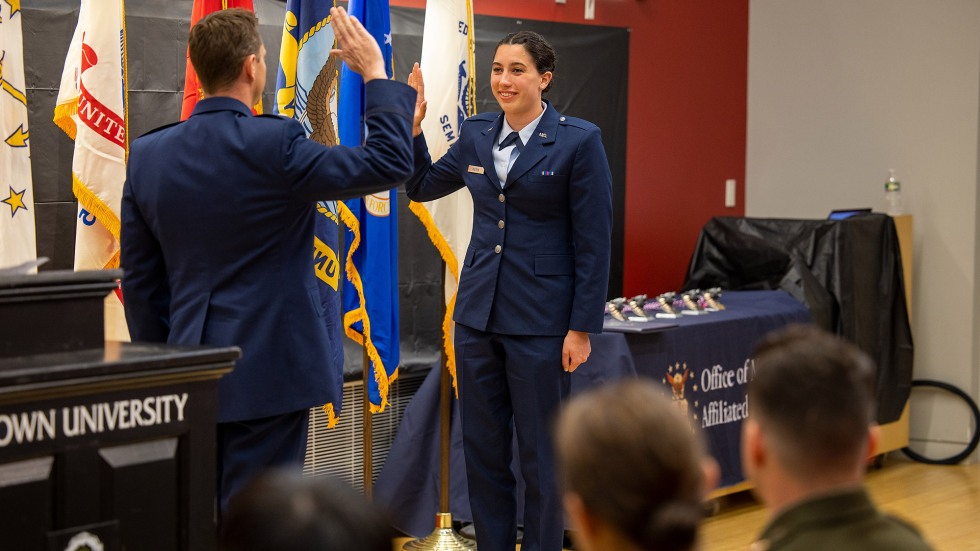 Two military officers raising their hands