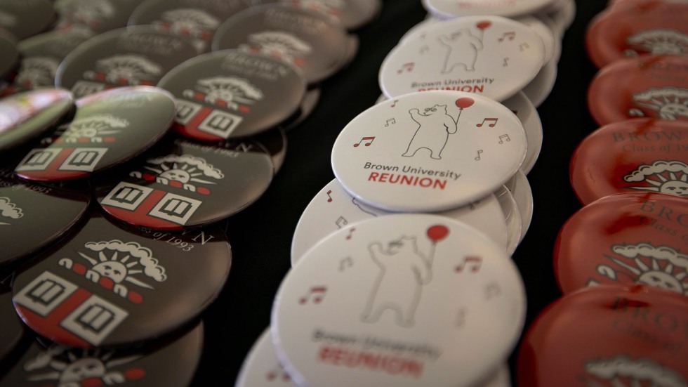 closeup of Brown University buttons arranged on a table