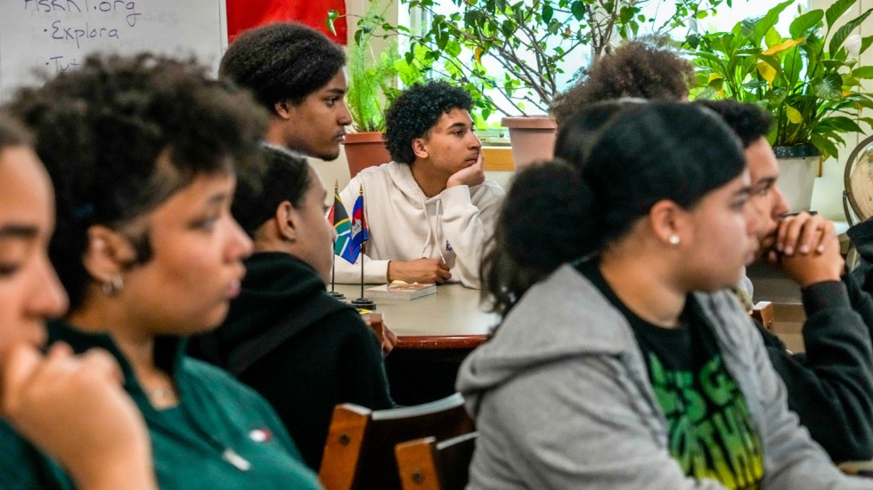 students at Juanita Sanchez Educational Complex listening to a speech