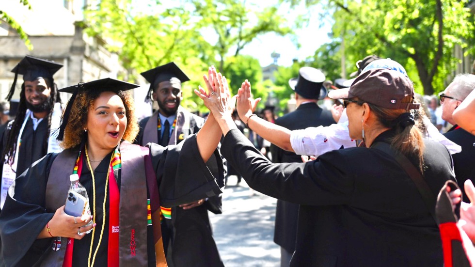 Woman high fiving a crowd