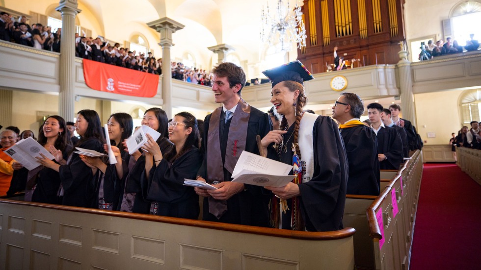 Students smile in the pews during Brown's Baccalaureate ceremony