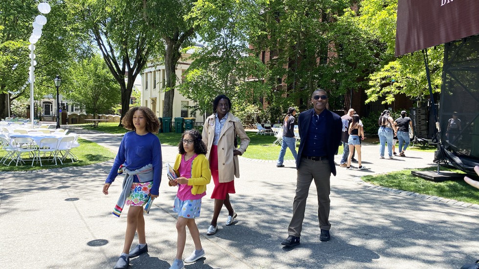 Michael, Claire and Elisabeth Simmons walk with Alycia Mosley Austin