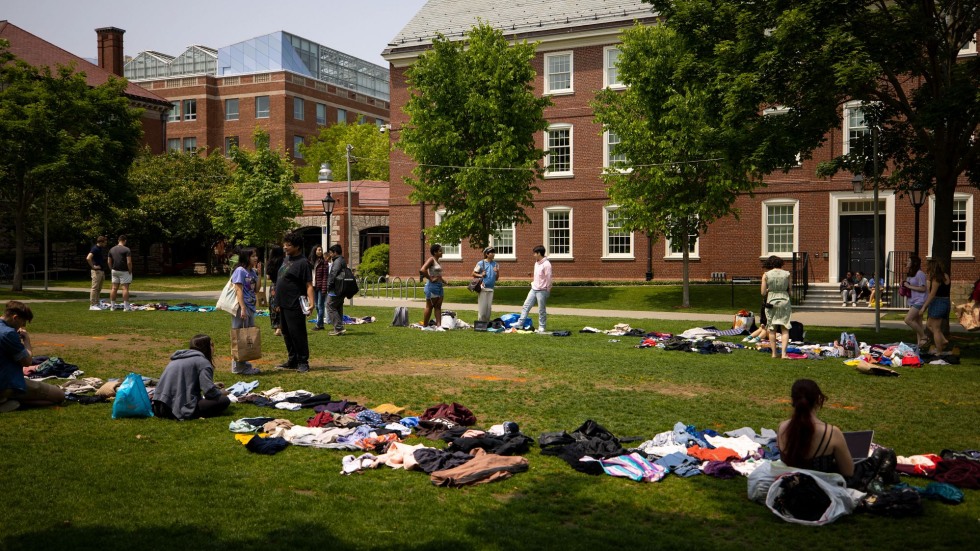 students look through clothes at the donation drive