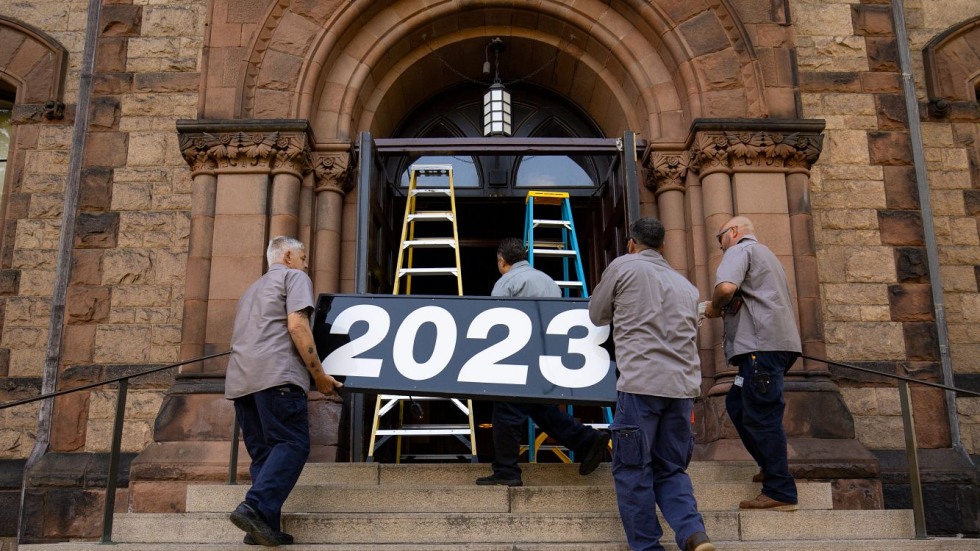 Facilities Management team carries sign up steps