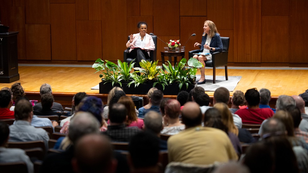 Donna Hicks and Marie Williams seated on stage