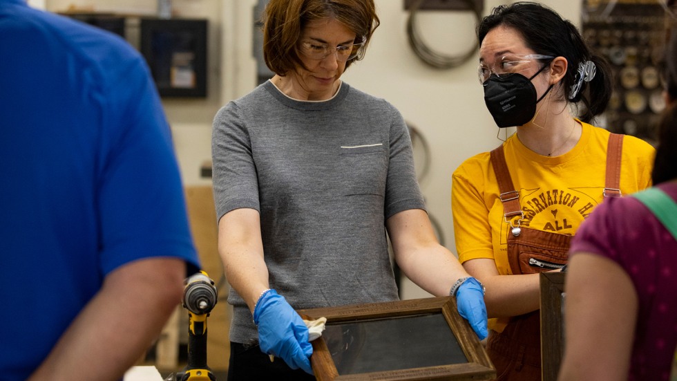 people work on a carpentry project