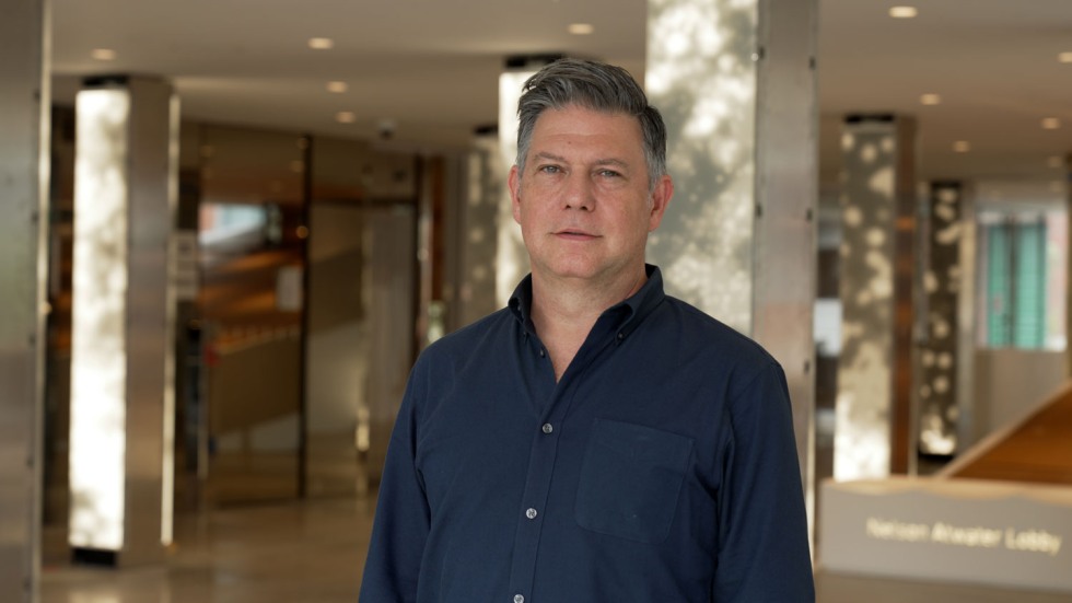 Leo Villareal standing among LED-lit columns