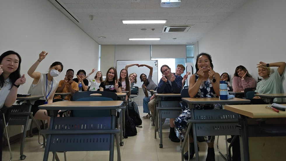 students sitting at desks in a classroom