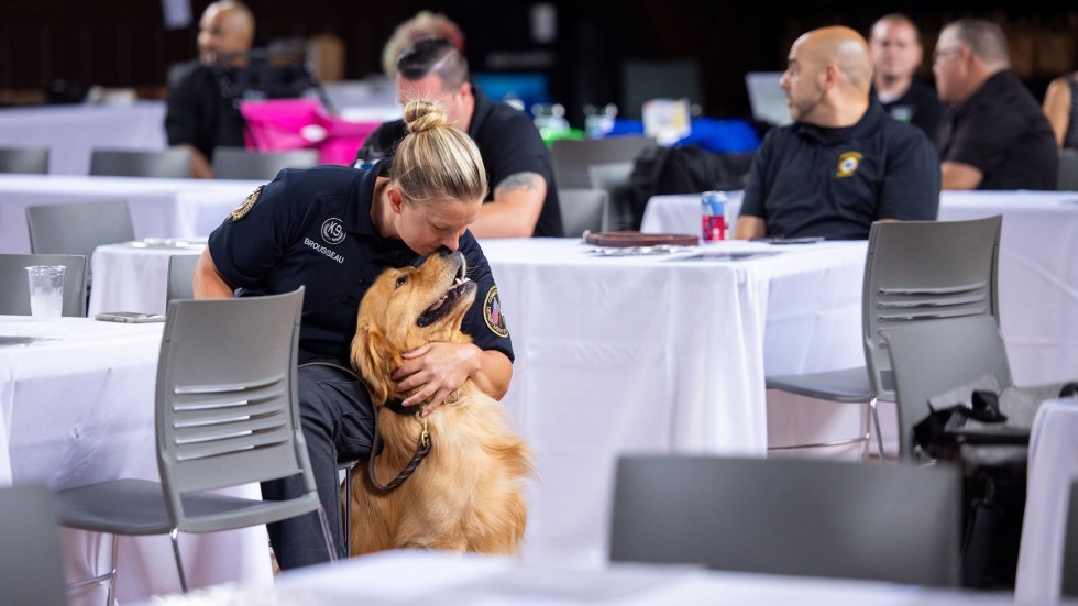 Woman nuzzles her dog