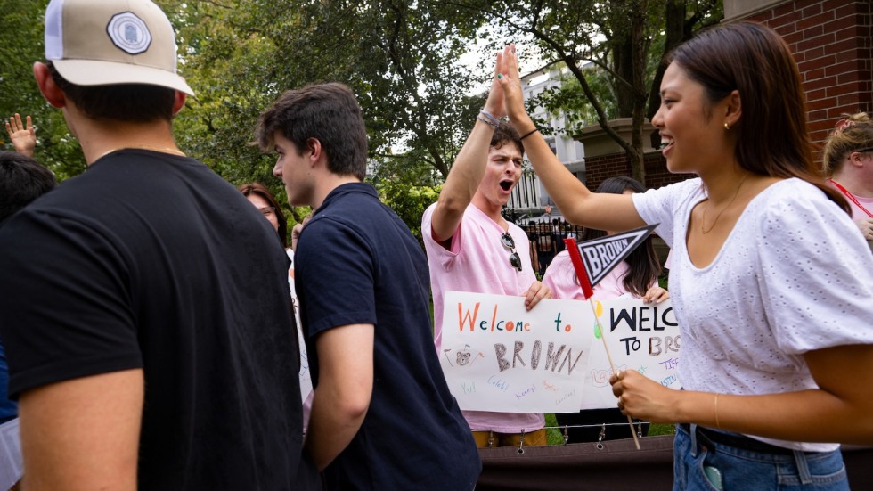 two students high fiving