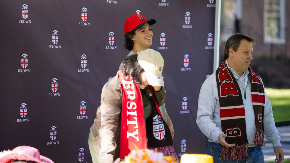 The Trope Mayer family dons props at the Family Weekend photo booth