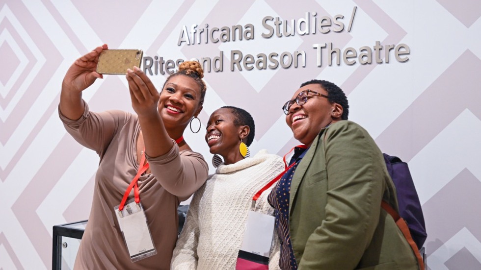 Three women gather to take a selfie