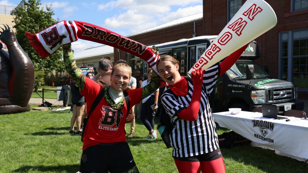 Students pose with Brown swag