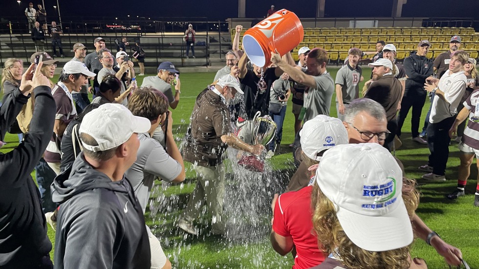 Rugby team pours water on coach's head, celebrating win 