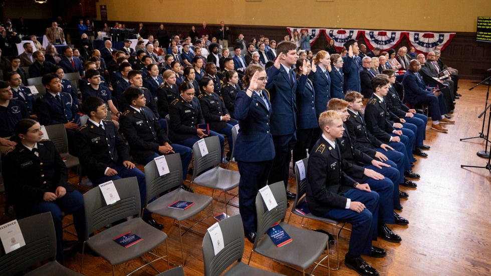 Air Force ROTC cadets stand to take their oath