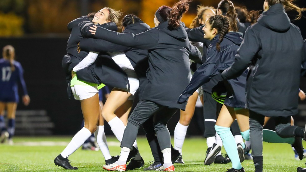 Women's soccer team celebrates after a win