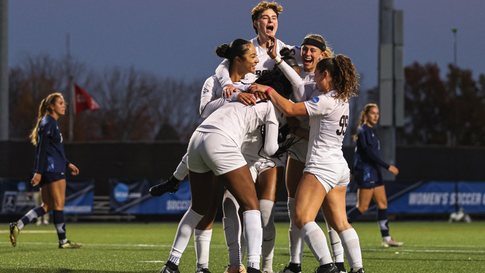 Women's soccer team celebrates after a win