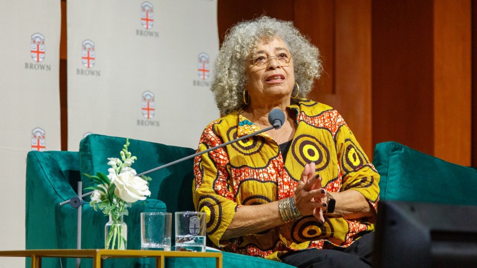 Angela Davis speaking on a stage