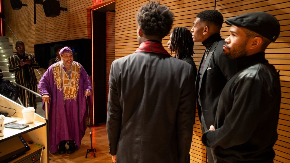 people greeting each other on a stage