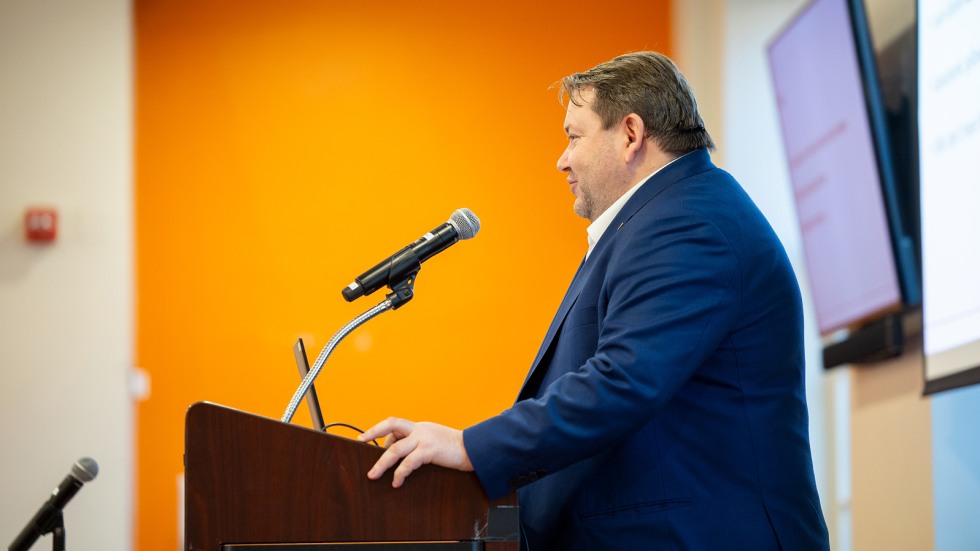 vladyslav rashkovan speaks at podium