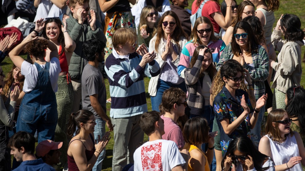 crowd of students dances on College Green