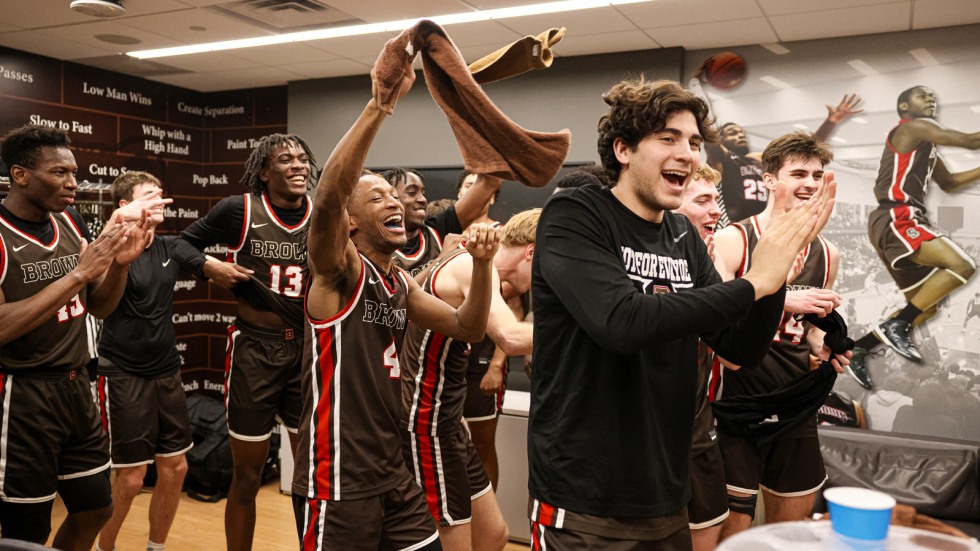 team celebrates in locker room