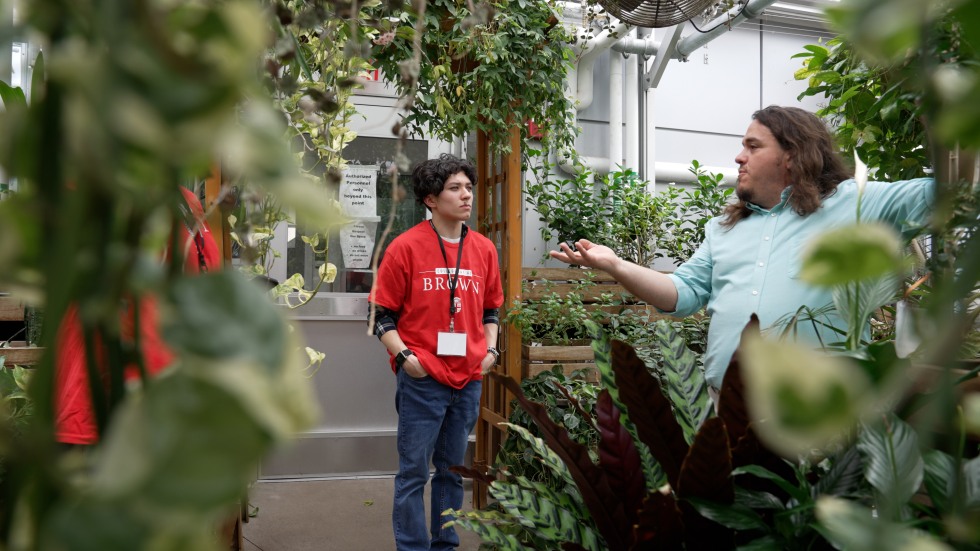 student in greenhouse 