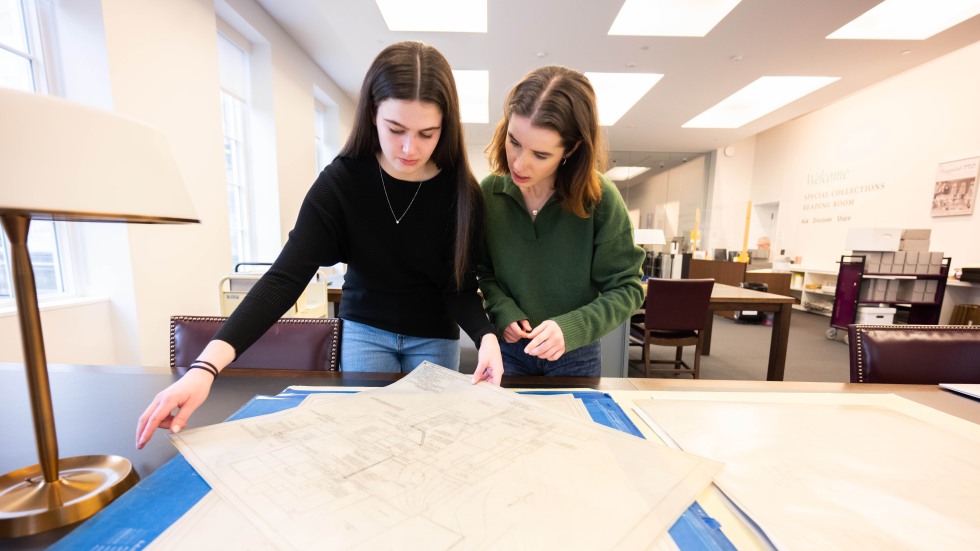 two students review documents