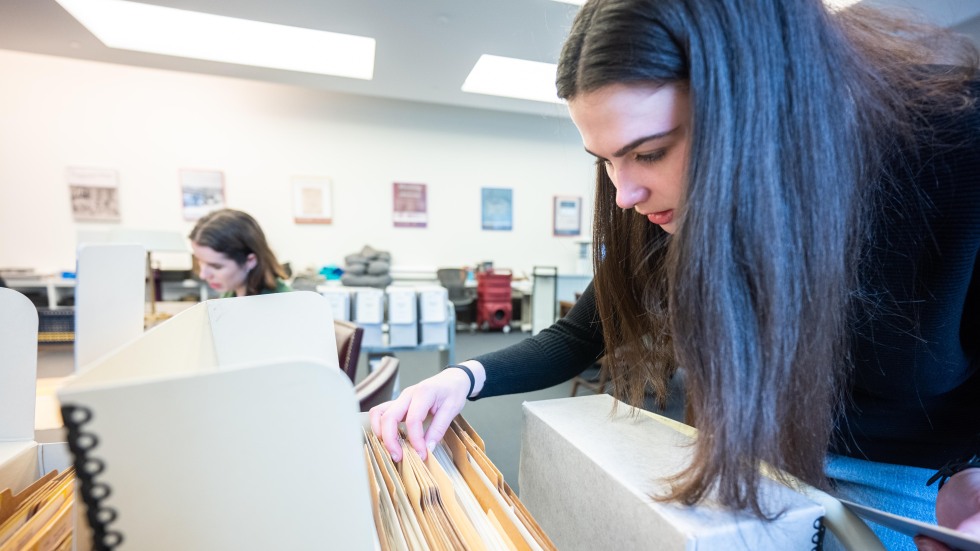 Student looking at files 