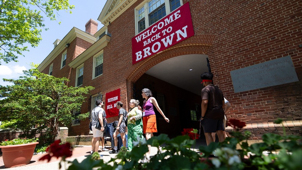 arch with sign that reads: Welcome back to Brown
