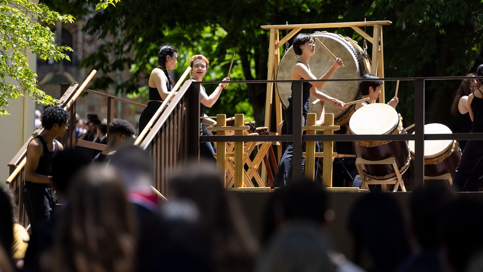 Taiko drummers perform on lawn