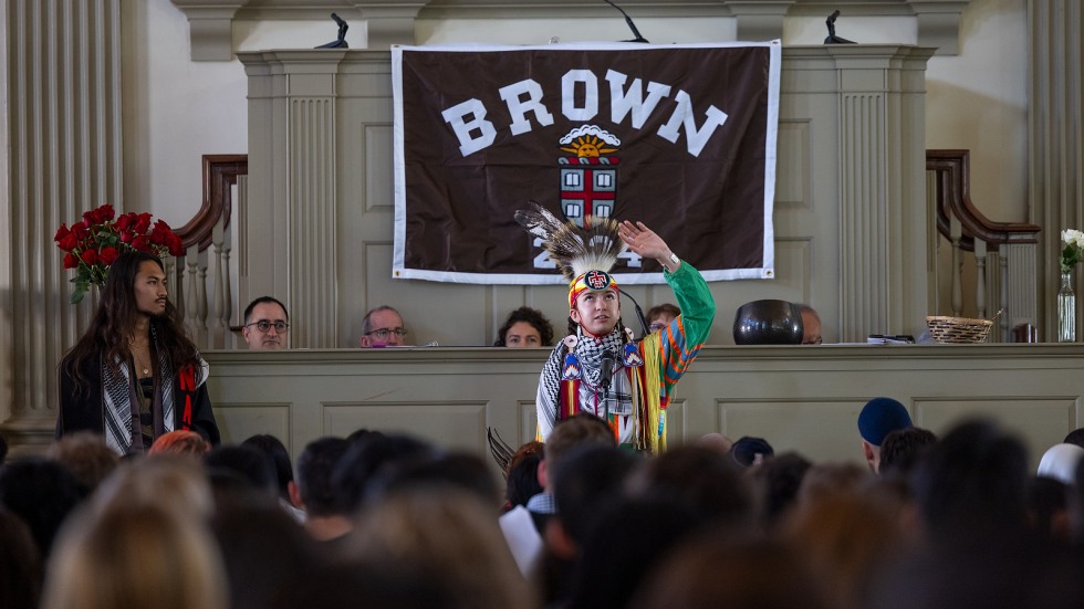 Indigenous student performs welcome in full regalia