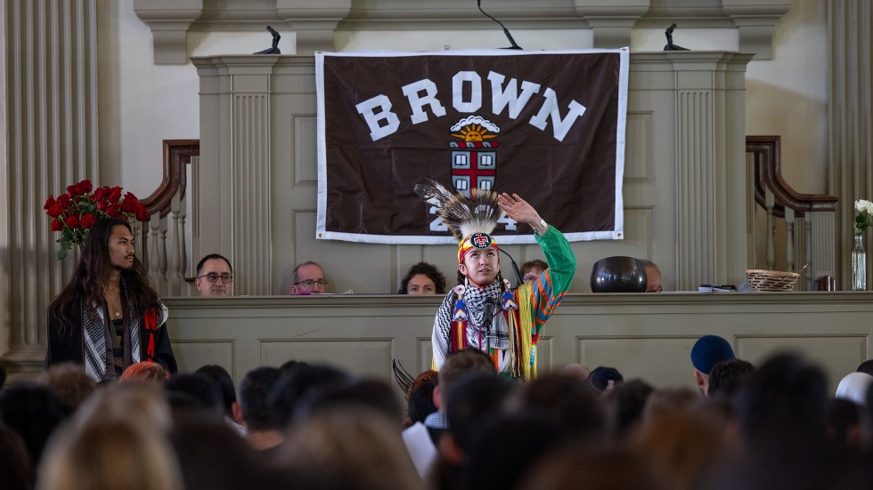 Indigenous student performs welcome in full regalia