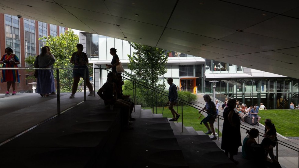 people walking into building 