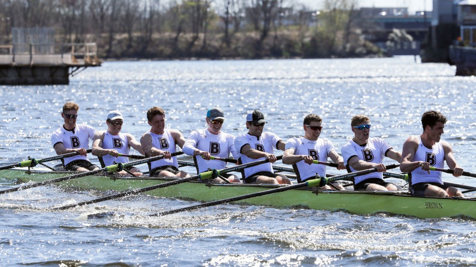 men's varsity crew team rows together