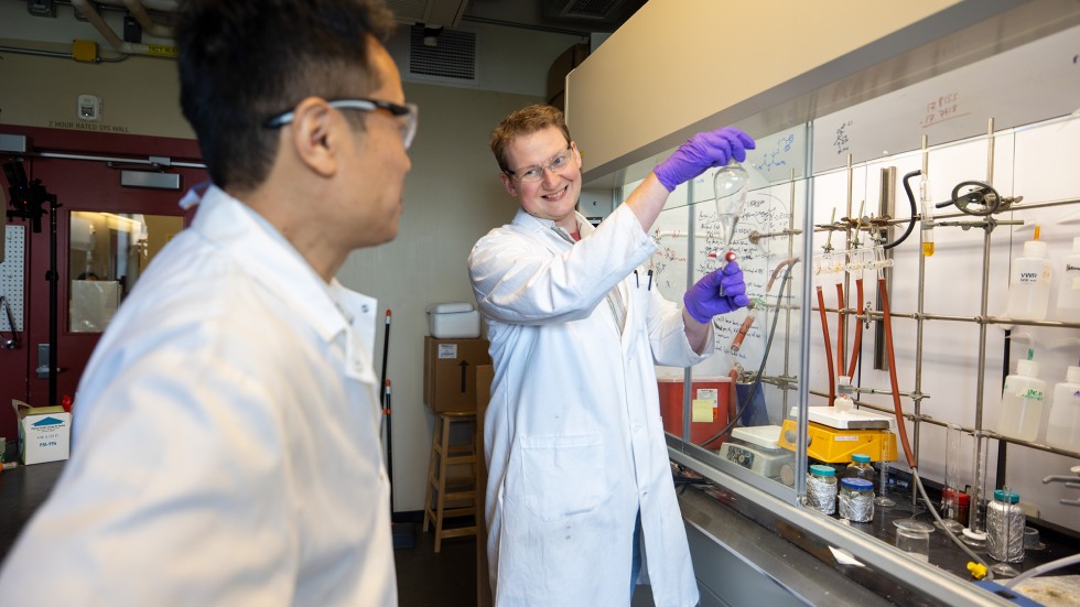Two scientists working together in a lab.