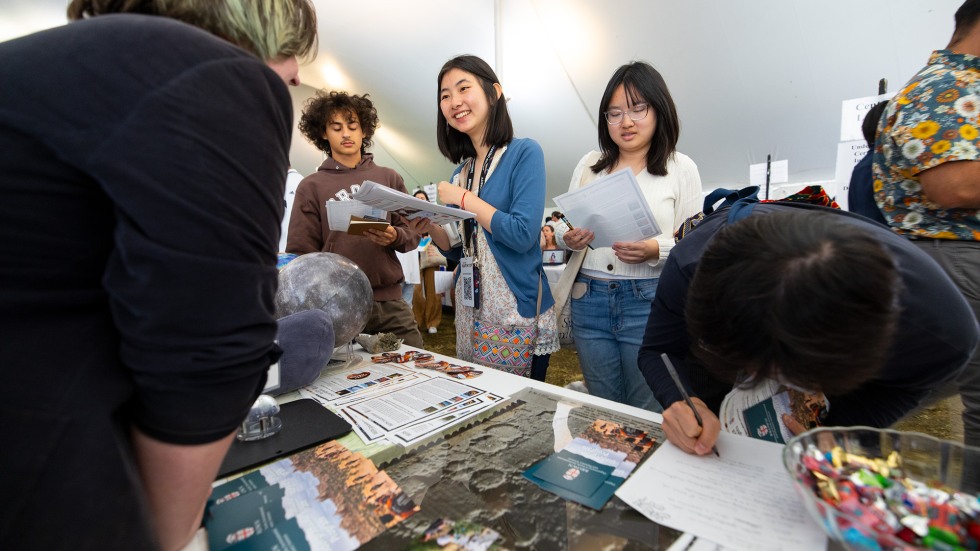 Student looking at material on table