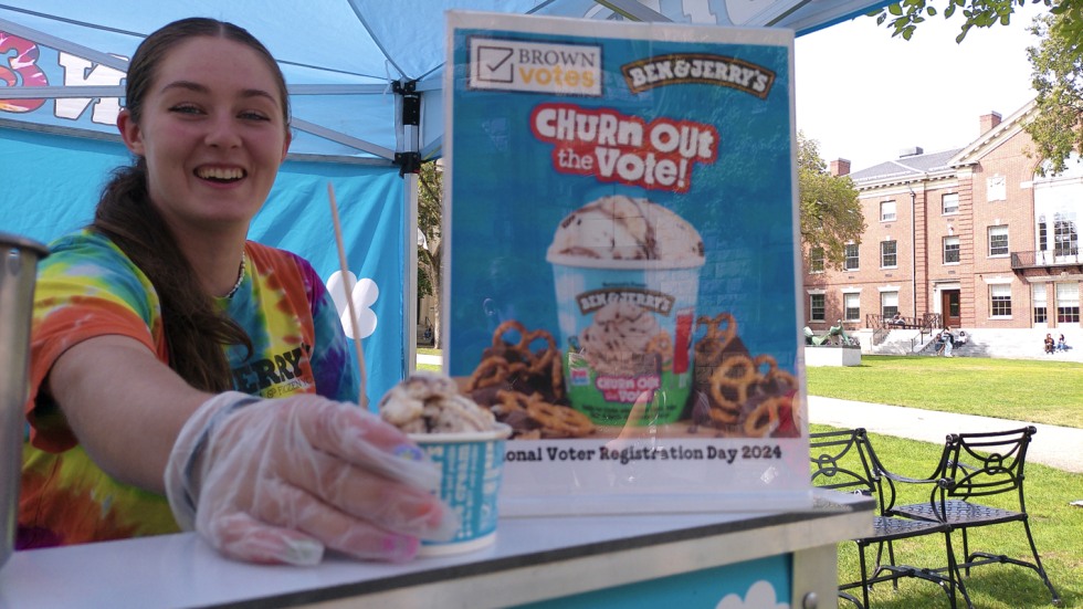 Worker hands out free scoop of ice cream