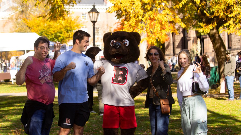 Family poses with Bruno mascot